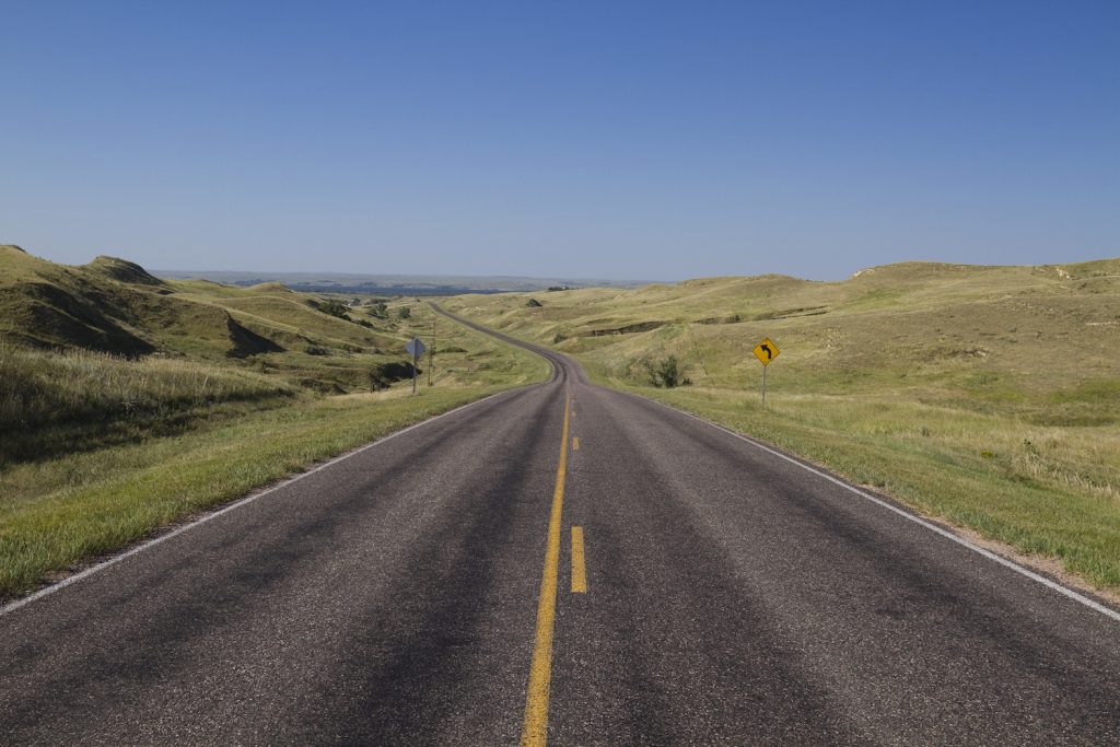 A highway traveling in the sandhills of Nebraska.