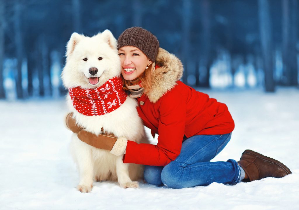 Woman With Dog in the Snow
