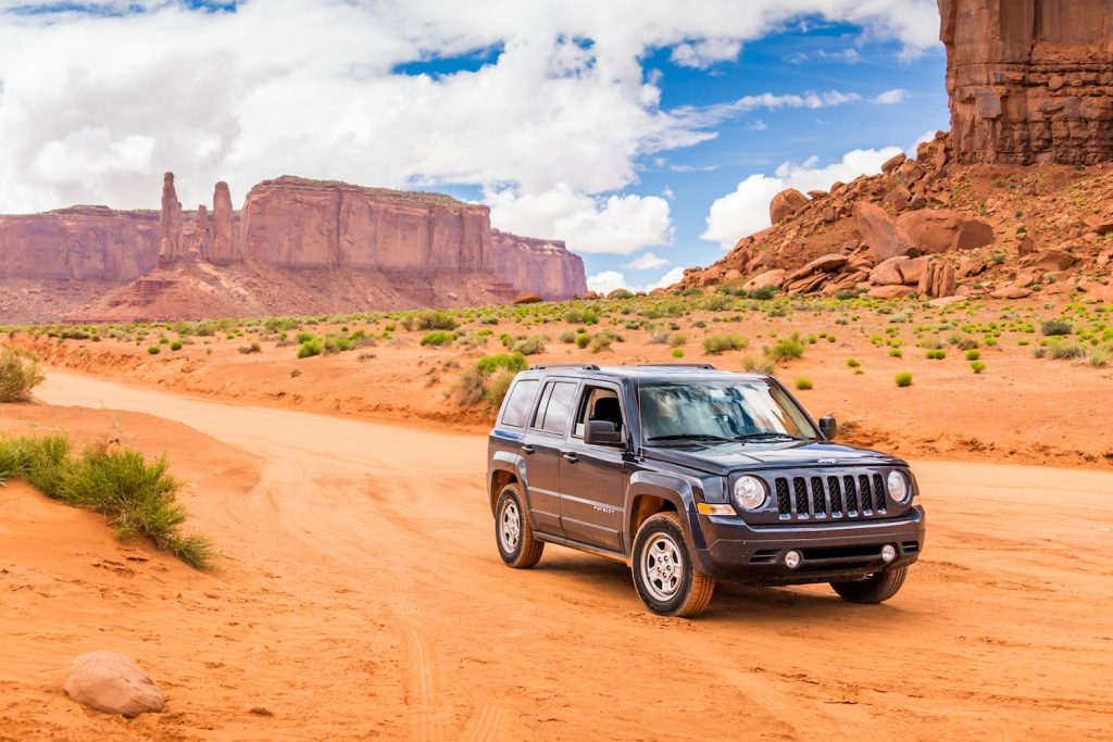Monument Valley, Utah, Usa - May 25, 2015 - Offroading Through The Monument Valley In A Jeep Patriot