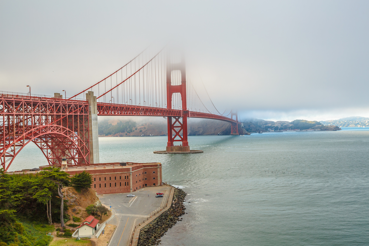 Aerial view of Golden Gate Bridge from Fort Point, south shore, symbol, icon and landmark of San Francisco, California, United States. Typical fog in summertime. Travel and holidays concept.