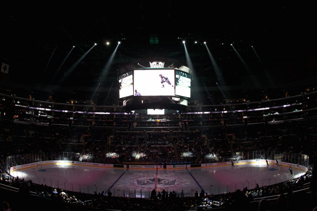 Staples Center Arena, lights dimmed, just before the start of a hockey game