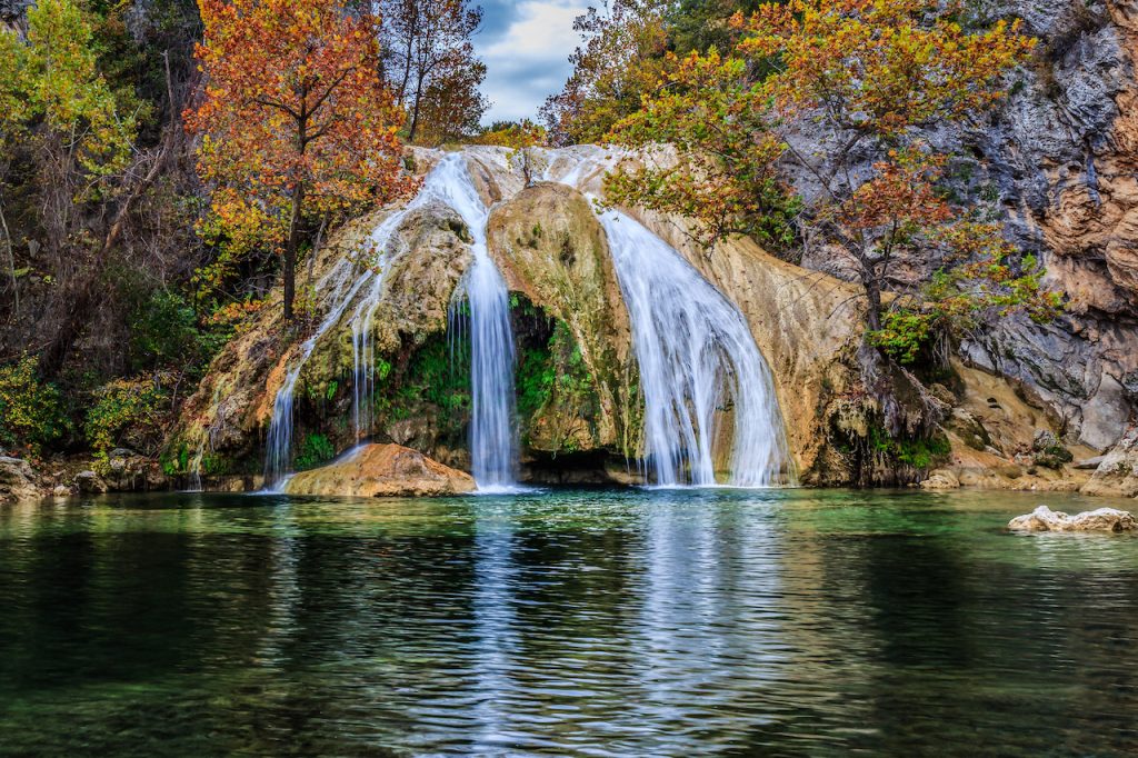 Turner Falls at 77 feet (23 m) is locally considered Oklahoma's tallest waterfall although its height matches one in Natural Falls State Park. The falls are located on Honey Creek in the Arbuckle Mountains in south central Oklahoma near the city of Davis.