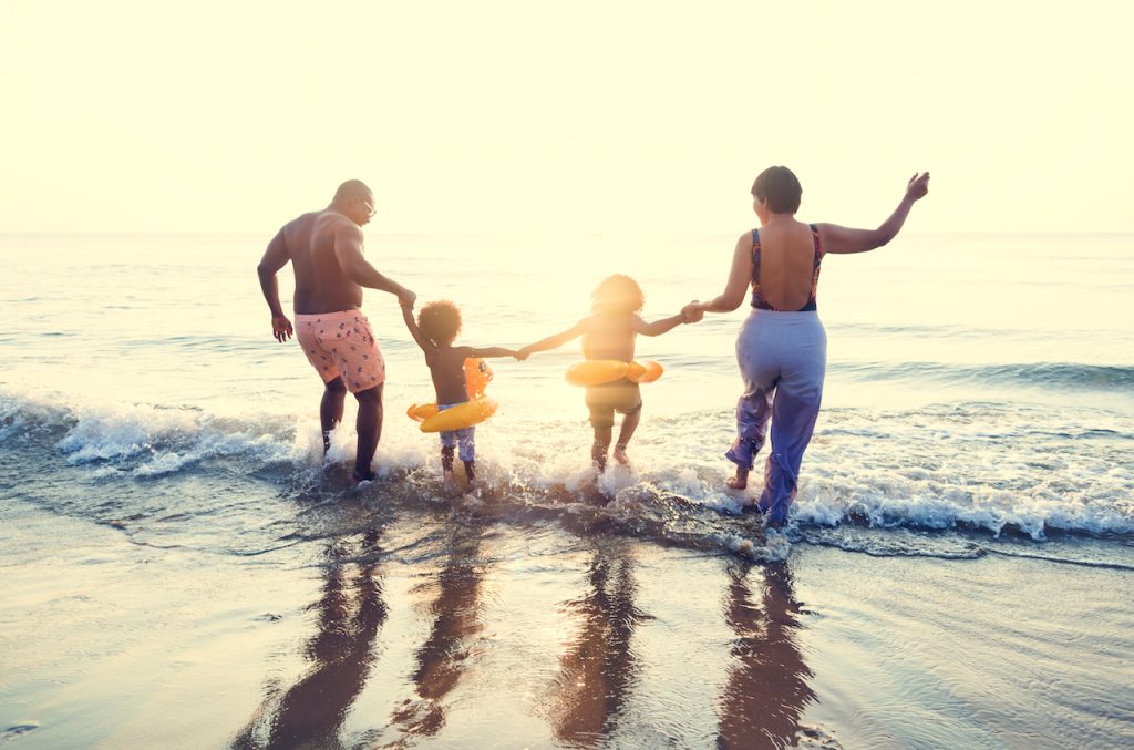 cute family having fun on the beach