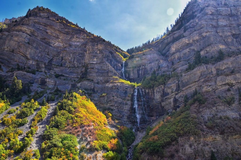 view of Bridal Veil Falls in Provo, Canyon with water falling and autumn leaves 