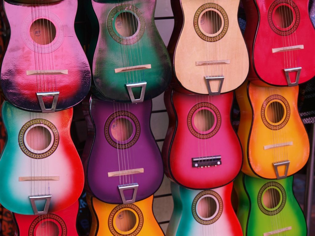 Wall of bright and colorful guitars