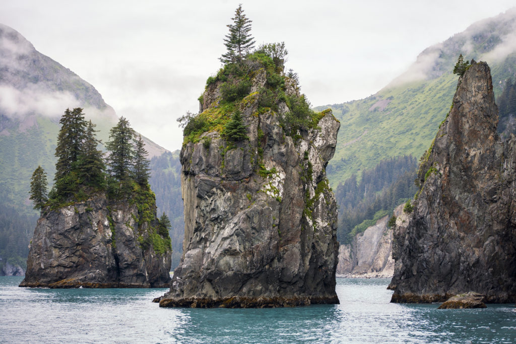 A seascape photograph of sea stacks in Kenai Fjords National Park in Alaska,