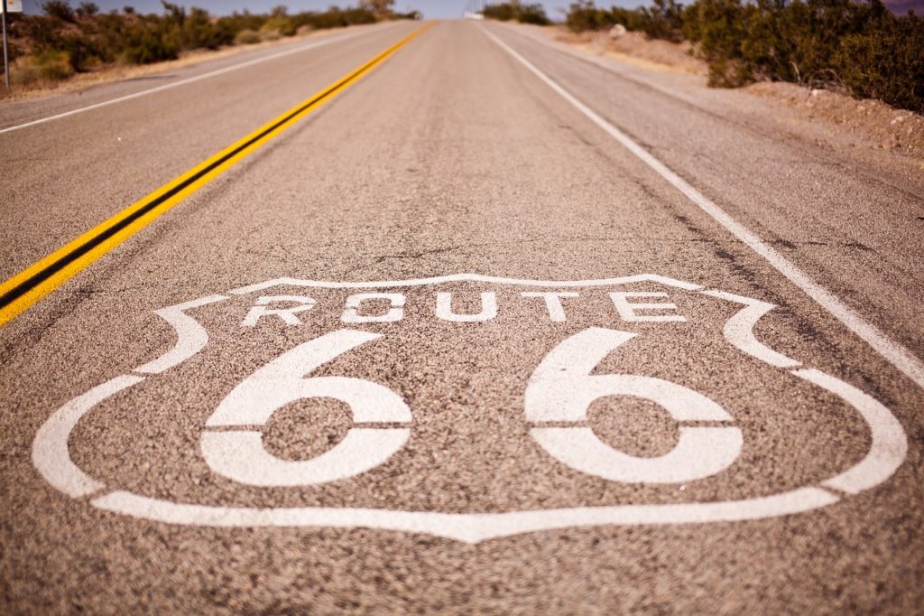 Painted Route 66 sign on the floor in the middle of the highway 